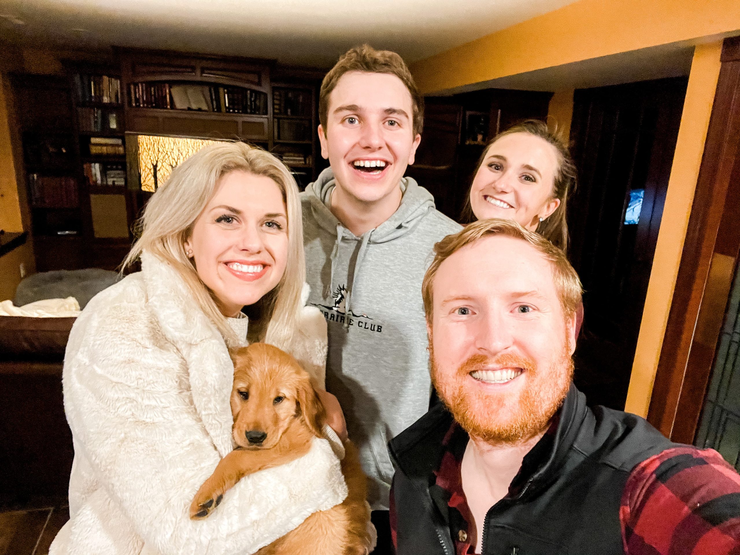 Sarah and Troy Klongerbo with their brother, sister-in-law, and their puppy