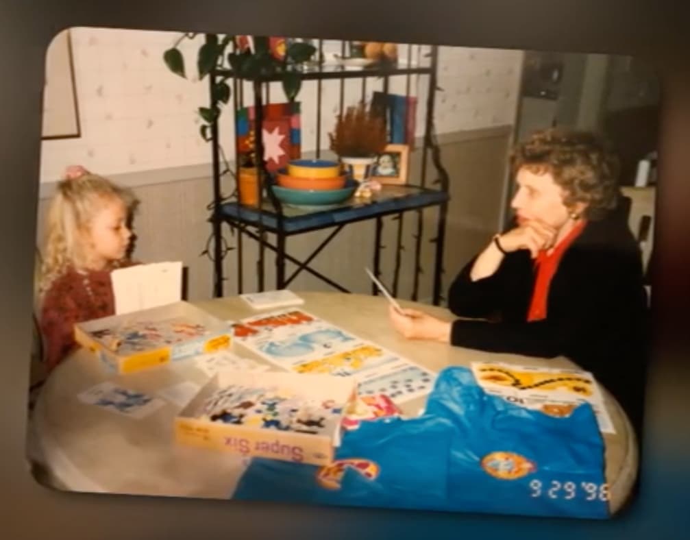 Sarah Klongerbo playing cards with her grandma Helen