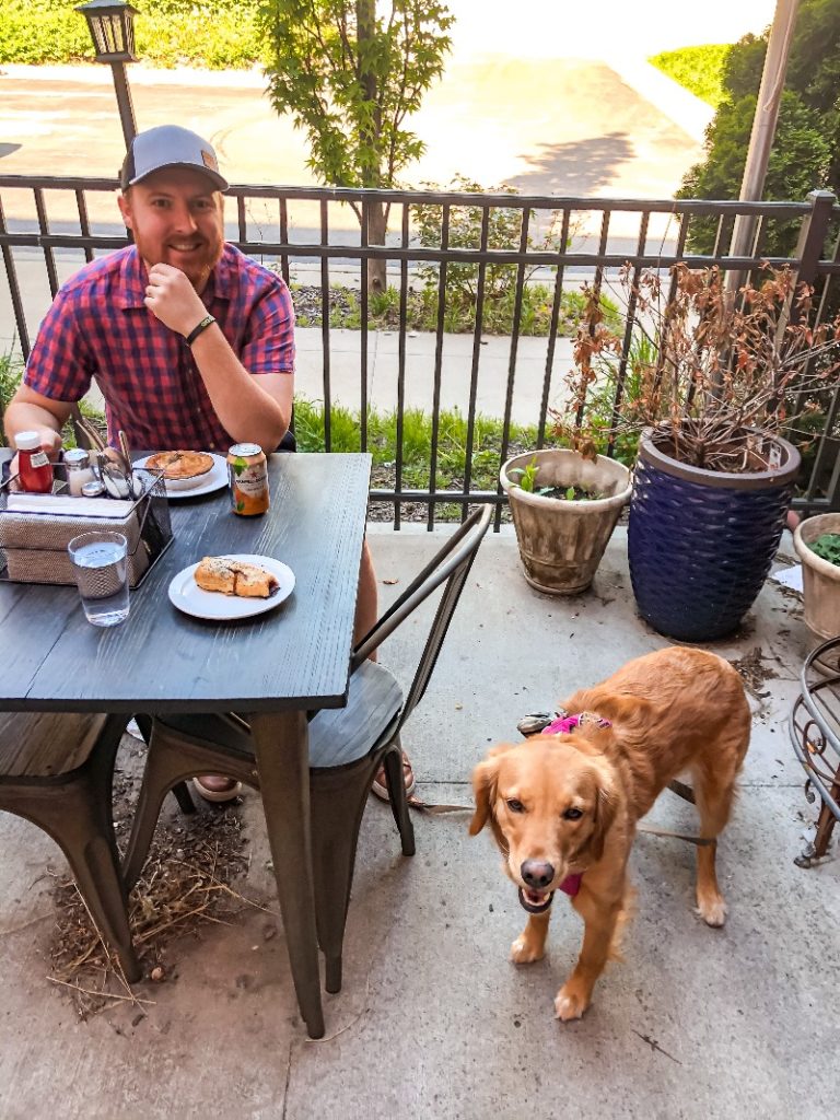 Troy Klongerbo and his dog Pali eating breakfast in Kansas City