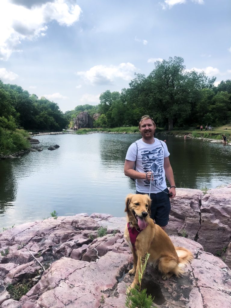 Troy Klongerbo and his dog Pali at the Palisades in South Dakota