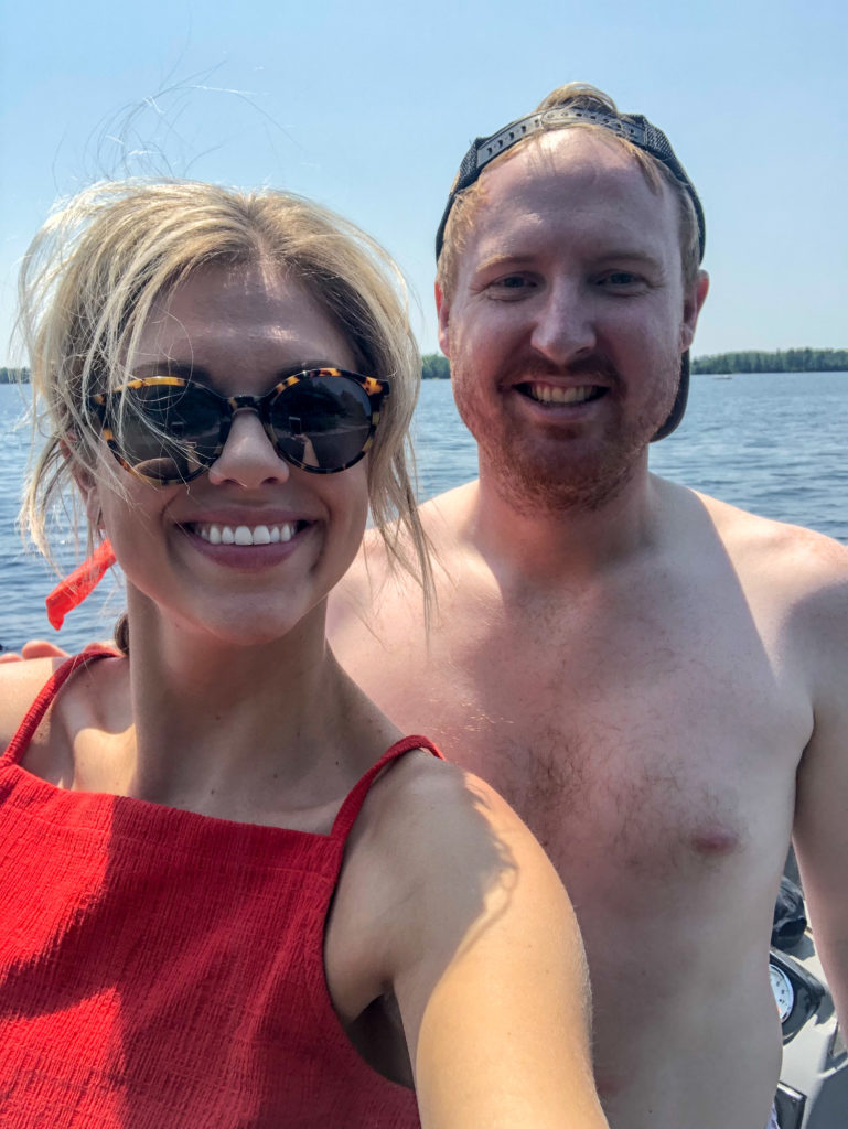 Troy and Sarah Klongerbo on a boat in Minnesota