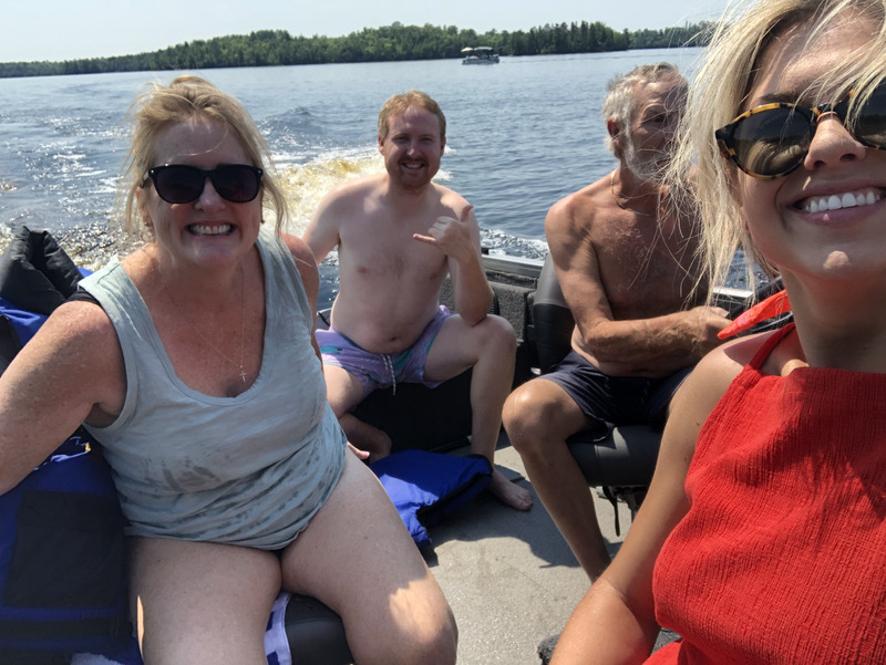 Troy and Sarah Klongerbo on a boat in Minnesota with Troy's parents