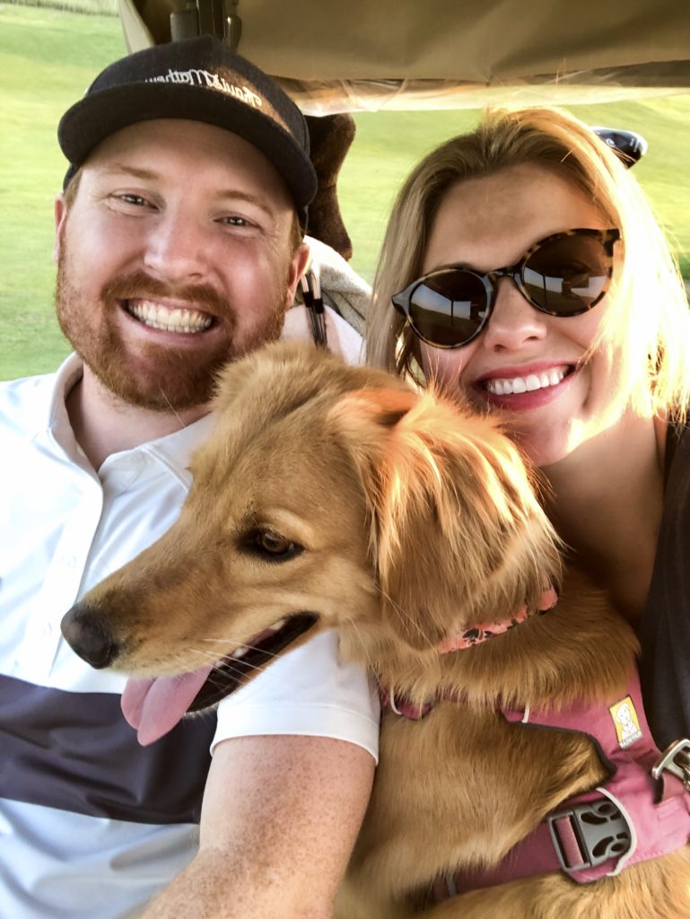 Troy and Sarah Klongerbo golfing at The Prairie Club with their dog Pali