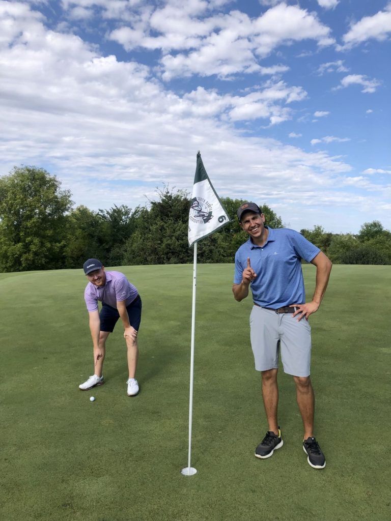 Kyle Schock getting his fourth hole in one at Willow Run in Sioux Falls, with Troy Klongerbo