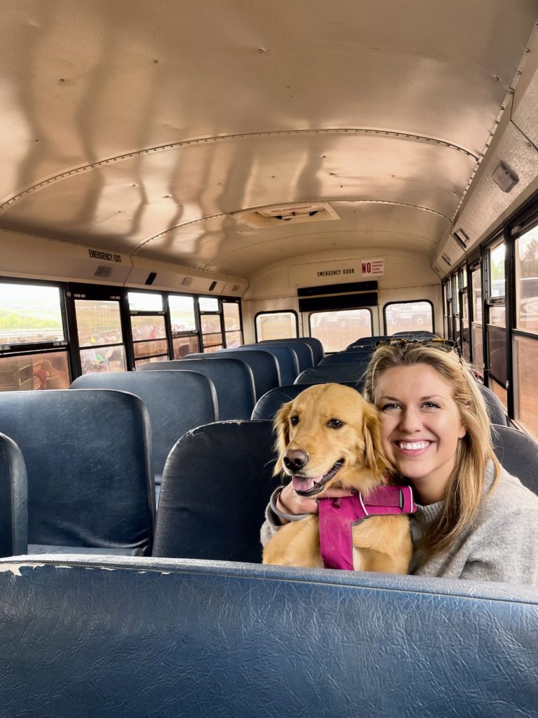 Sarah Klongerbo and her dog in a school bus