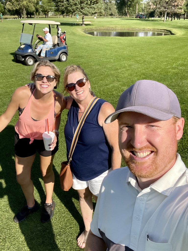 Troy and Sarah Klongerbo and his mom on the golf course