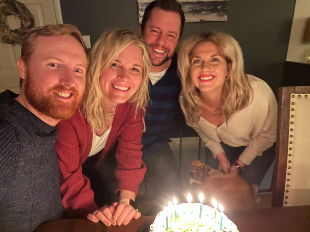 Troy and Sarah Klongerbo and their friends with ice cream cake