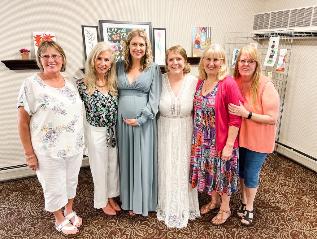 Sarah Klongerbo with the hosts of her baby shower