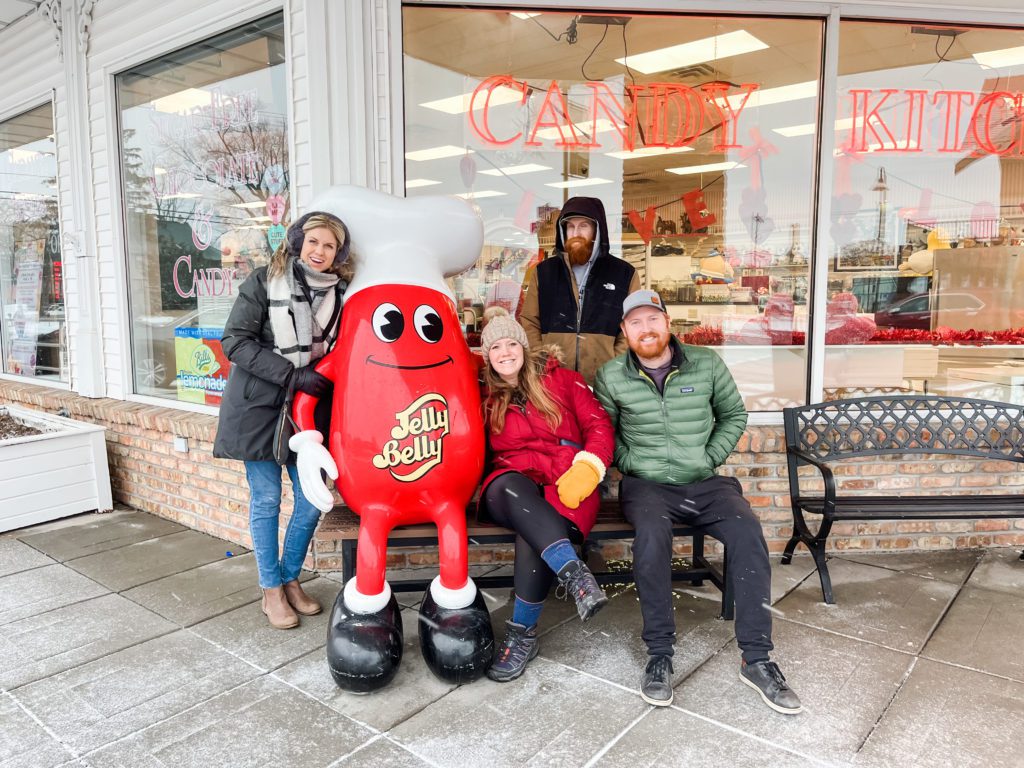 Sarah and Troy Klongerbo and their family by a jelly bean statue in the Wisconsin Dells
