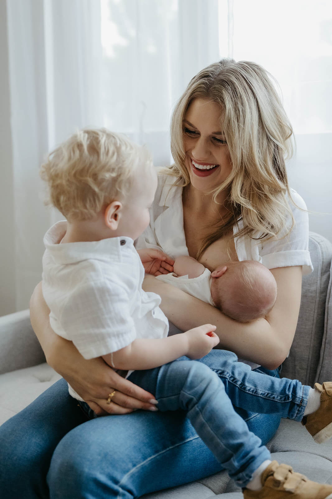 Sarah Klongerbo hugging her kids as a working mom of two