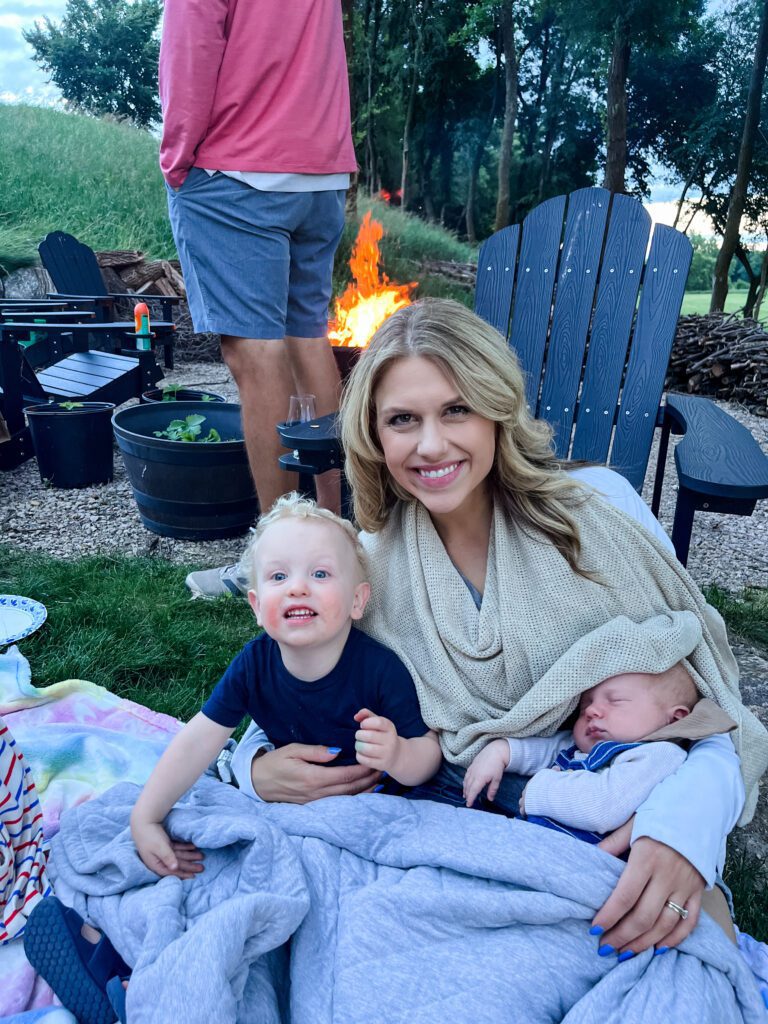 Sarah Klongerbo and her boys by the fire